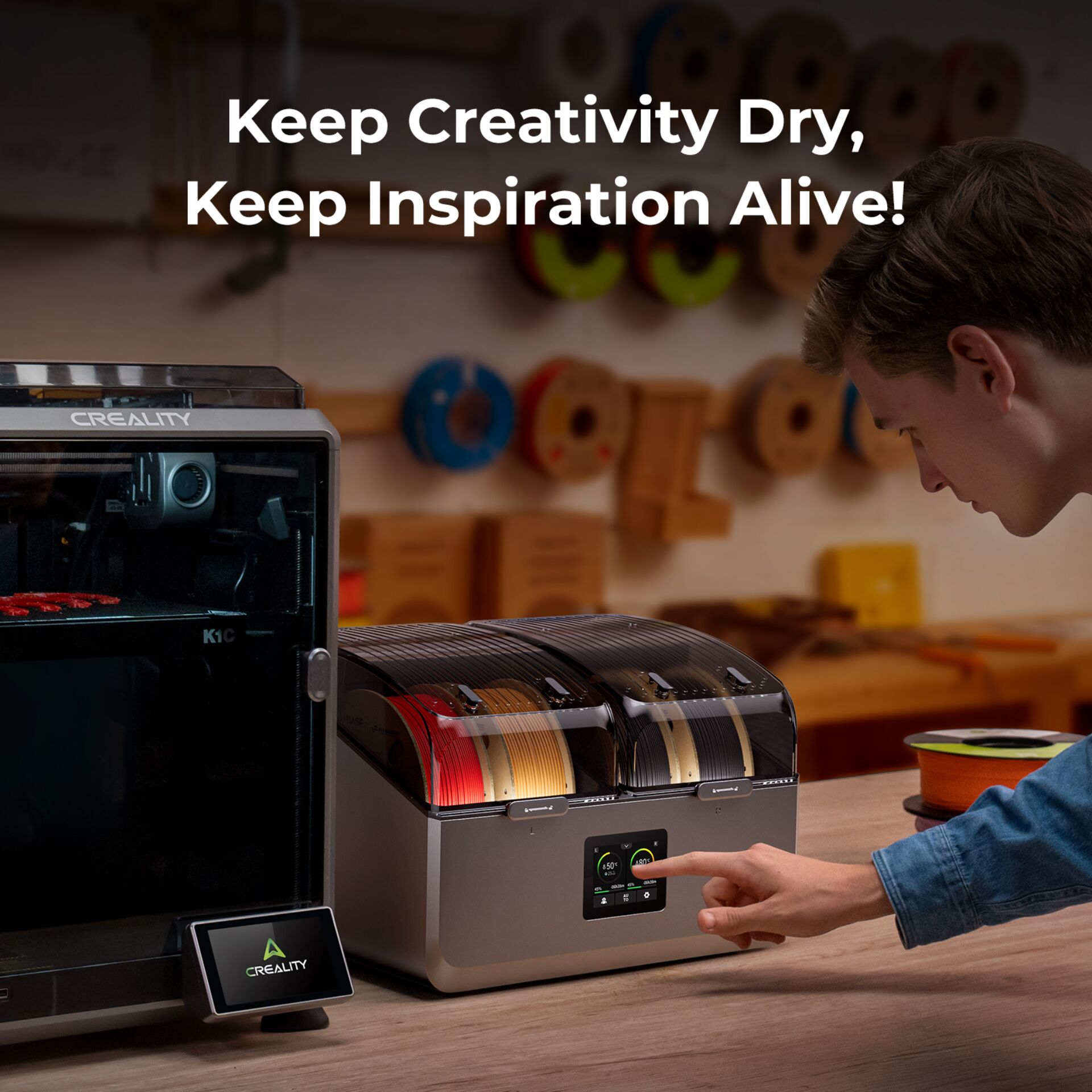3D printer, filament spool, cable organizer, wooden workbench, black-red-gray